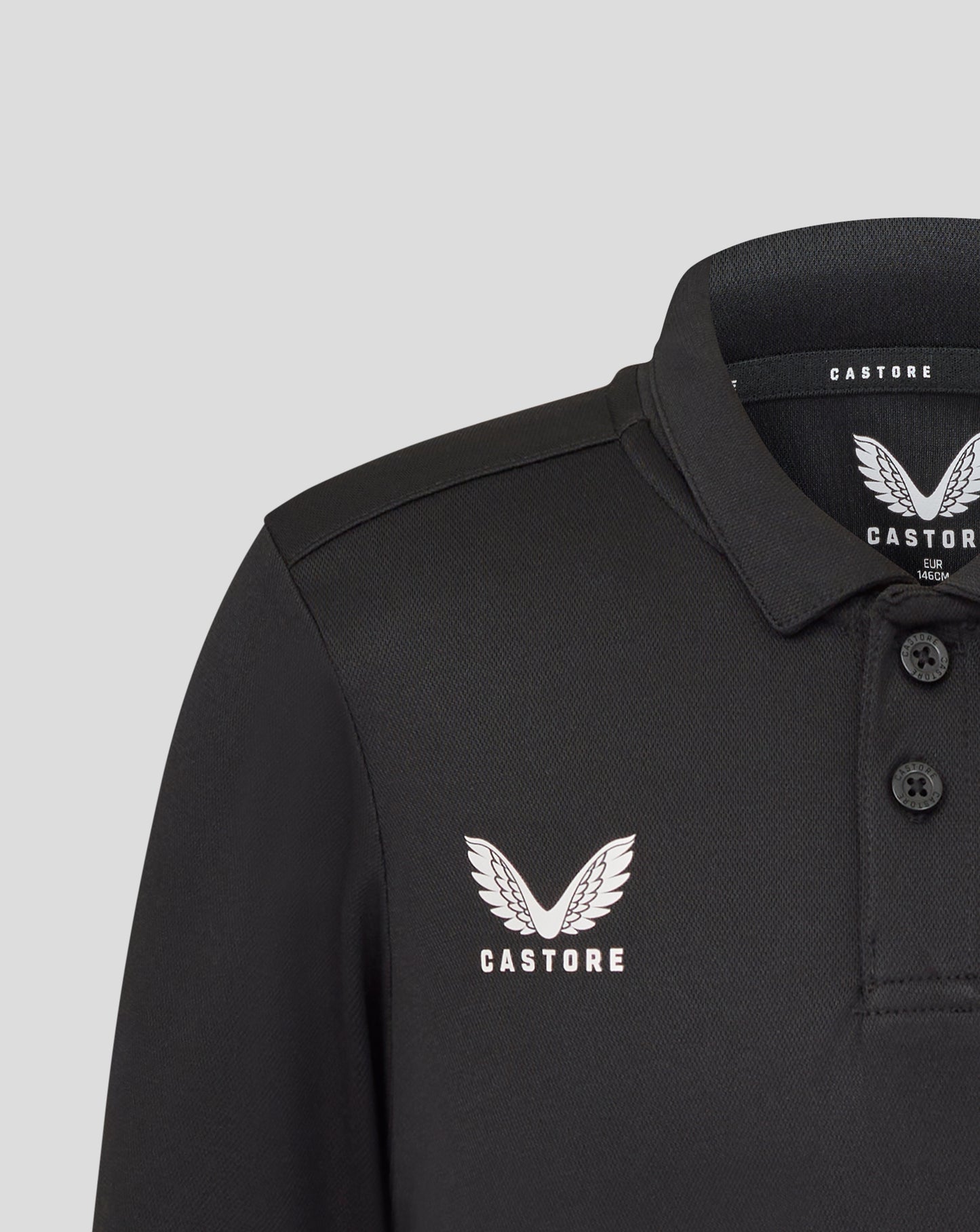 Close up of collar and chest with Castore branding on black Leicester Tigers junior training polo