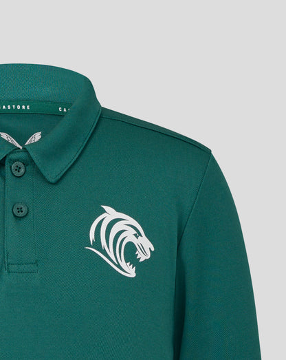 Front view of teal training polo with Castore logo on chest and partial wing emblem visible