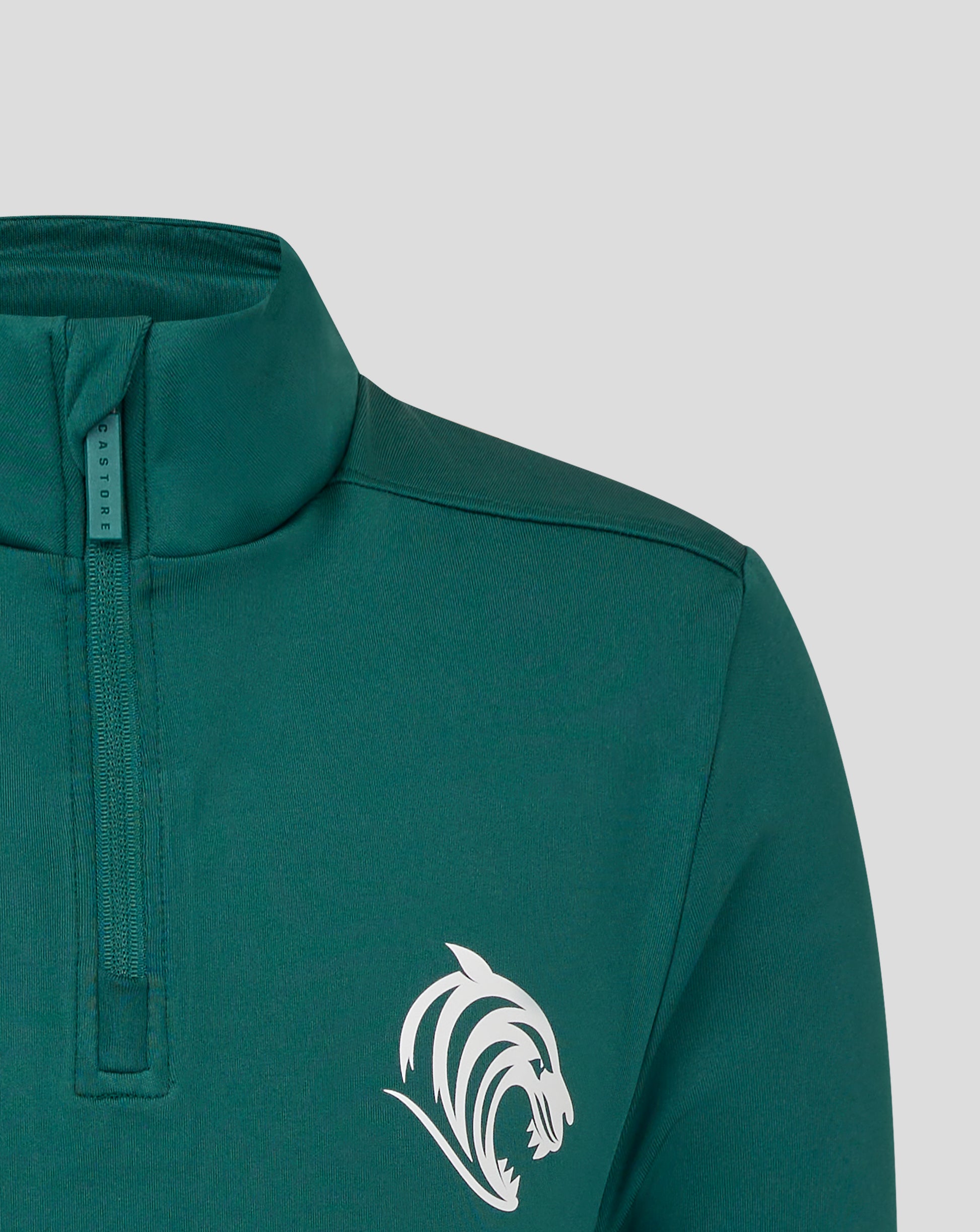 Collar and zipper detail of teal botanical Leicester Tigers junior training midlayer with Castore tag.