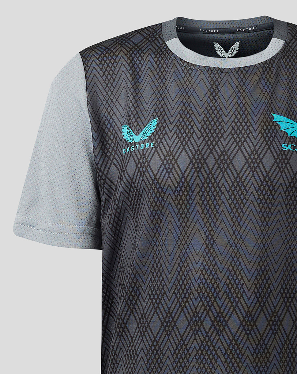 Youth Scarlets training T shirt with dark geometric front, light gray sleeves, turquoise club crest left chest and Castore branding