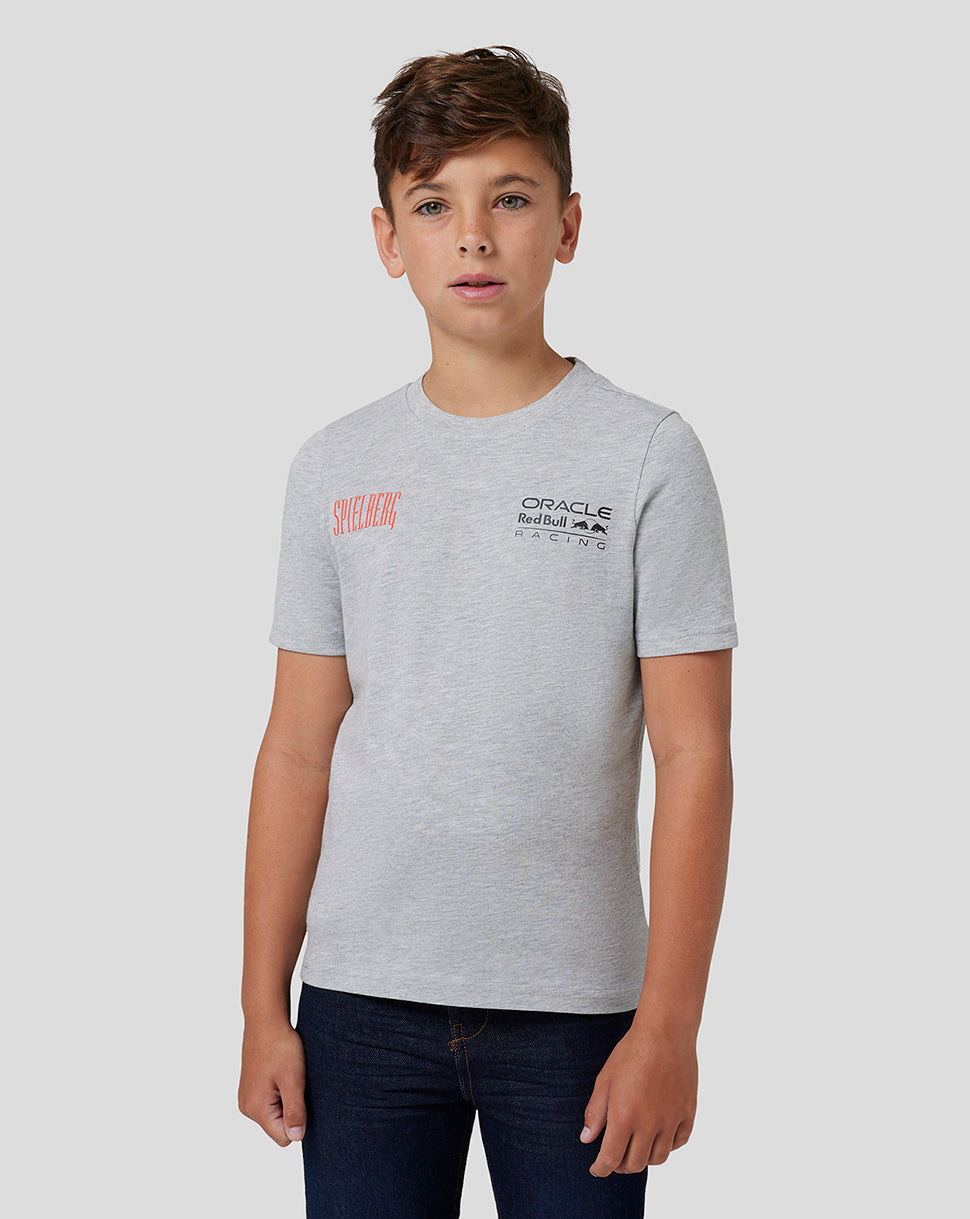 Boy in grey marl Red Bull Racing Spielberg T Shirt featuring Spielberg graphic and Oracle Red Bull Racing logo on the chest.