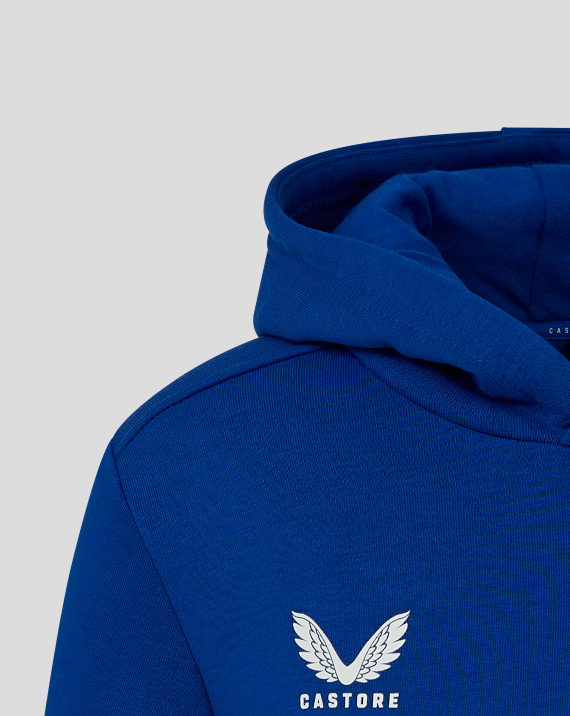Close up of the blue hood from the back of the Junior Cotton Leisure Hoodie.