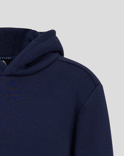 Close up of navy hoodie showing folded hood and shoulder with white Castore logo on the chest
