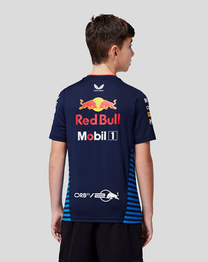 Back view of a young boy wearing a navy Red Bull Racing Teamline Set Up Tee with a large back logo