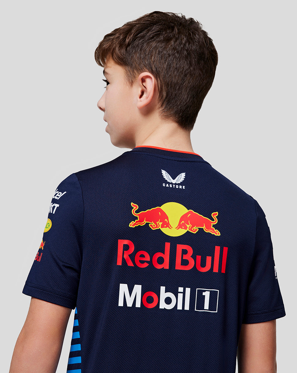 Back view of a boy in a night sky navy Oracle Red Bull Racing Set Up Tee with large Red Bull logo.