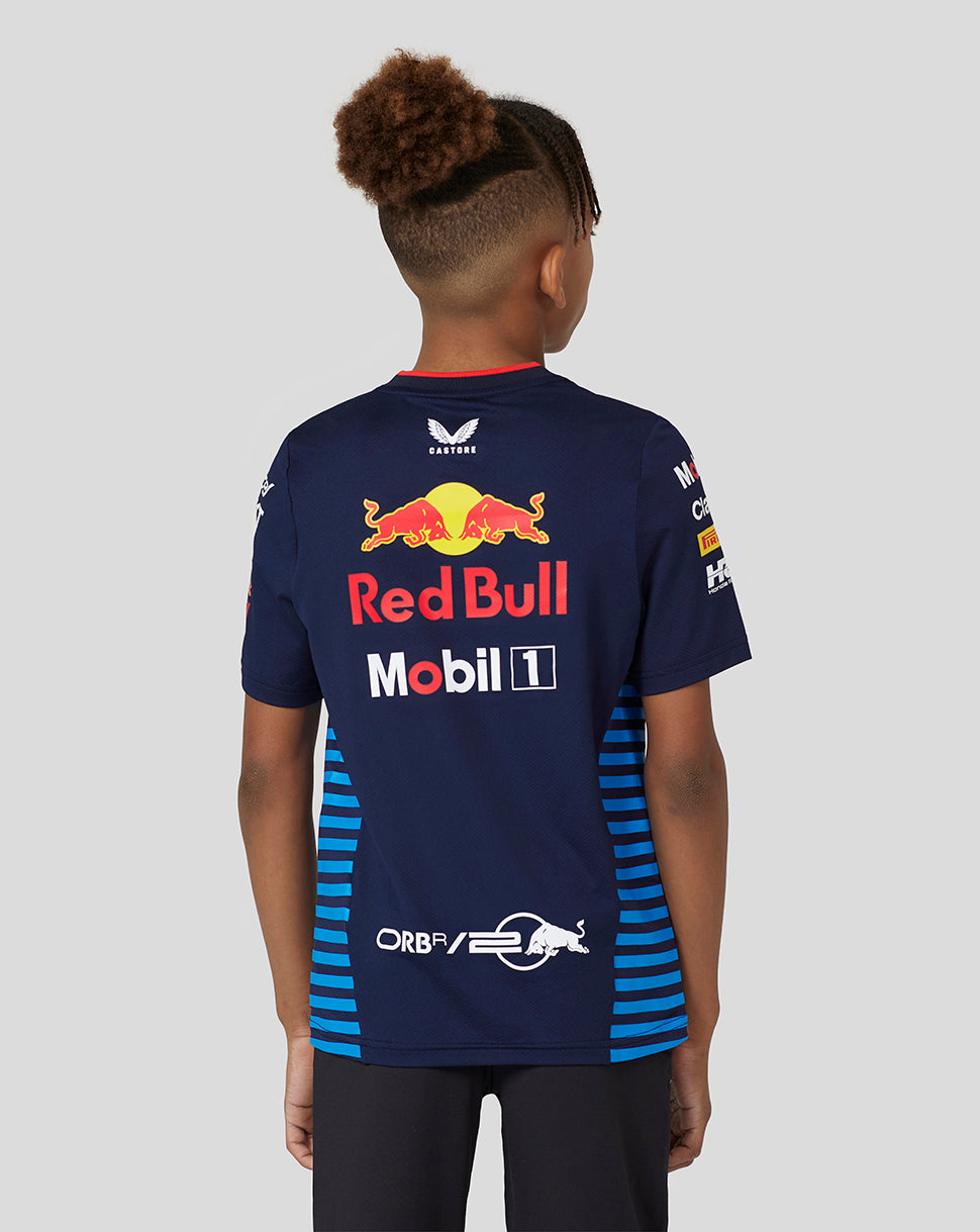 Back view of a young model wearing navy Night Sky Set Up Tee with large Red Bull logo and the 20th anniversary mark.