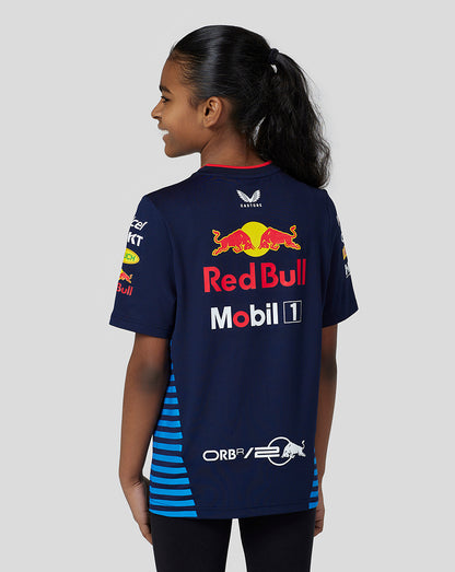 Back view of a girl wearing a navy Red Bull Racing Teamline Set Up Tee with blue side stripes and a large back logo