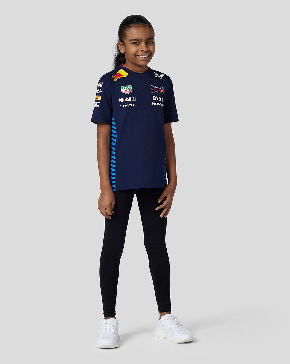 Girl wearing Oracle Red Bull Racing Set Up Tee Night Sky navy with blue side stripes and sponsor logos