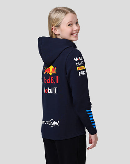 Side view of a young wearer in a navy Red Bull Racing Teamline hoodie showing blue stripe details on the sleeve