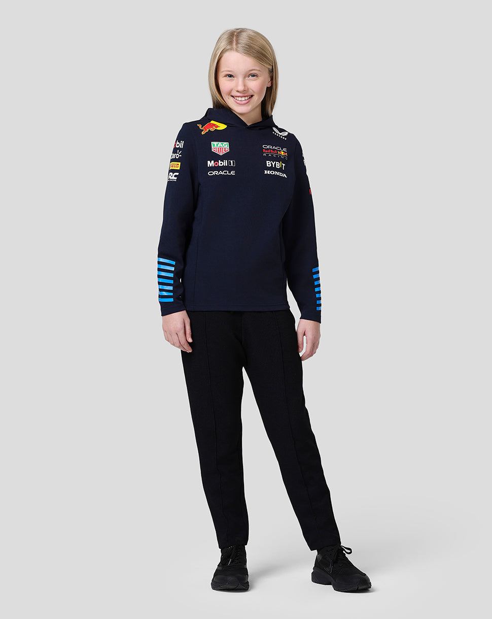 Young model wearing a navy Oracle Red Bull Racing junior pullover hoodie with team logos on chest and sleeves