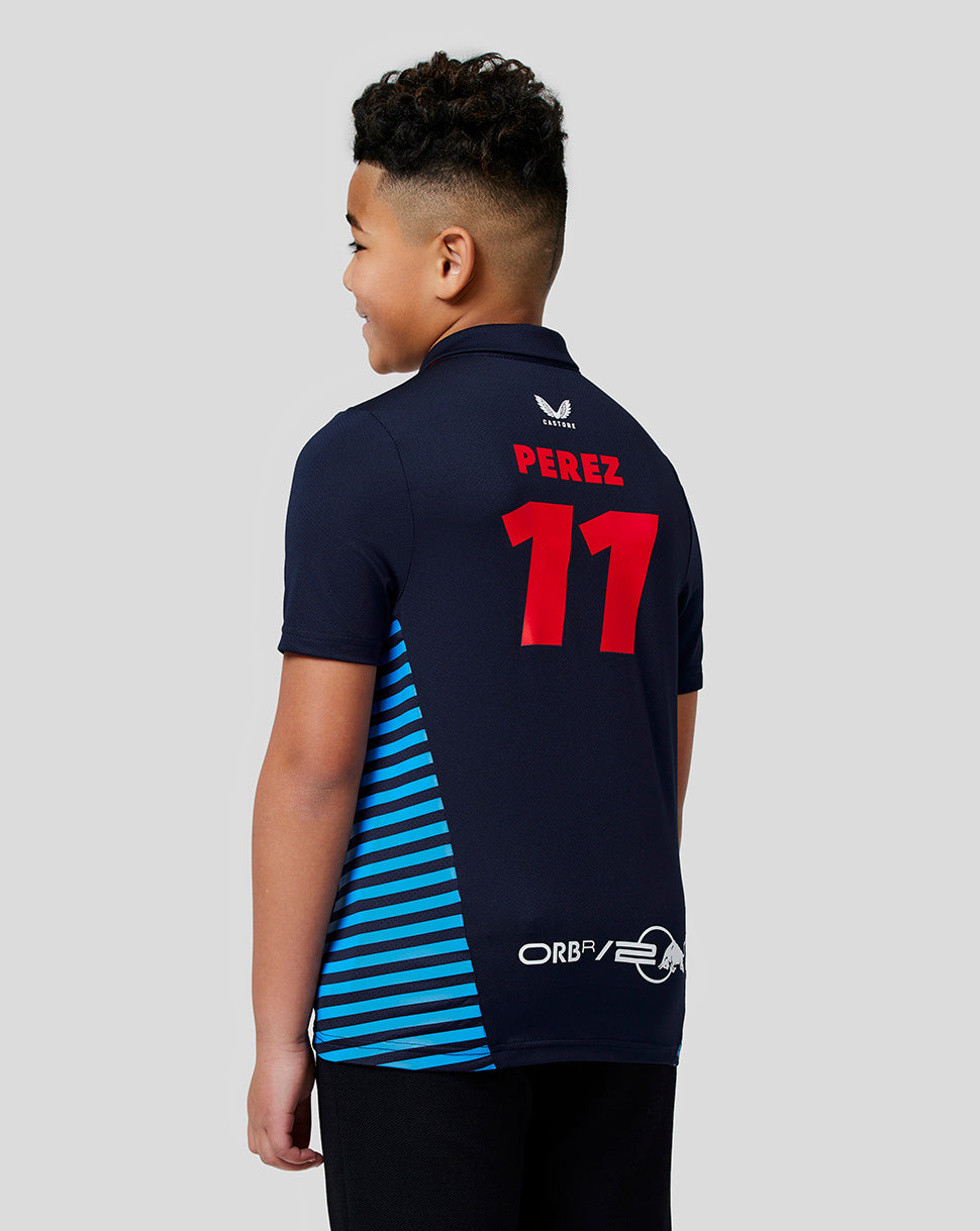 Back view of a boy in a navy Red Bull polo with PEREZ 11 on the back and blue striped side panel