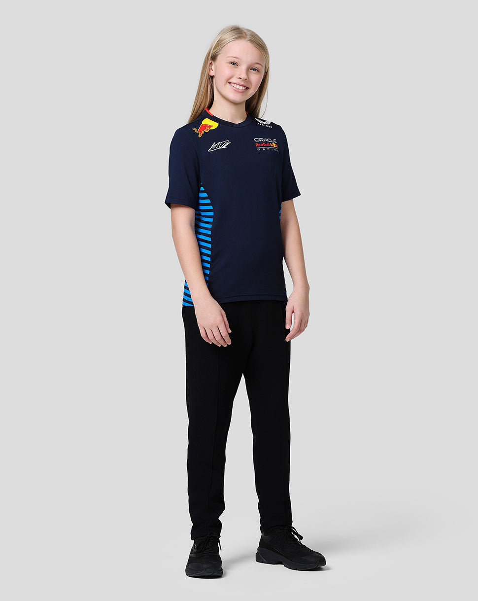 Junior Max Verstappen Teamline T shirt in Night Sky with Red Bull Racing logos and blue mesh side panels worn by a smiling kid