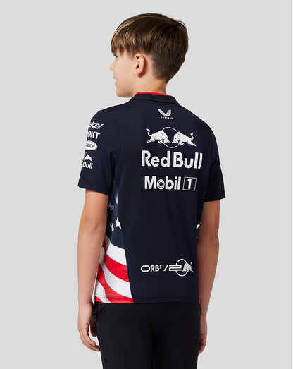 Back view of a young racer in a navy Red Bull Racing T shirt with large Red Bull Mobil 1 logos and American flag side panel