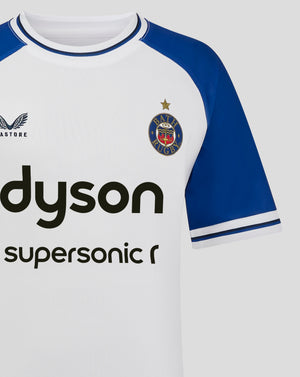 Close up of Bath Rugby junior away jersey collar and chest with crest on white fabric and blue trim