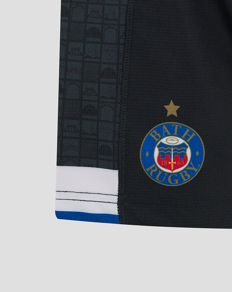Back view of Bath Rugby Junior Home Shorts featuring the Dyson logo across the back and white and blue striped hem