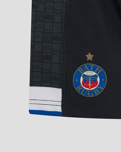 Back view of Bath Rugby Junior Home Shorts featuring the Dyson logo across the back and white and blue striped hem
