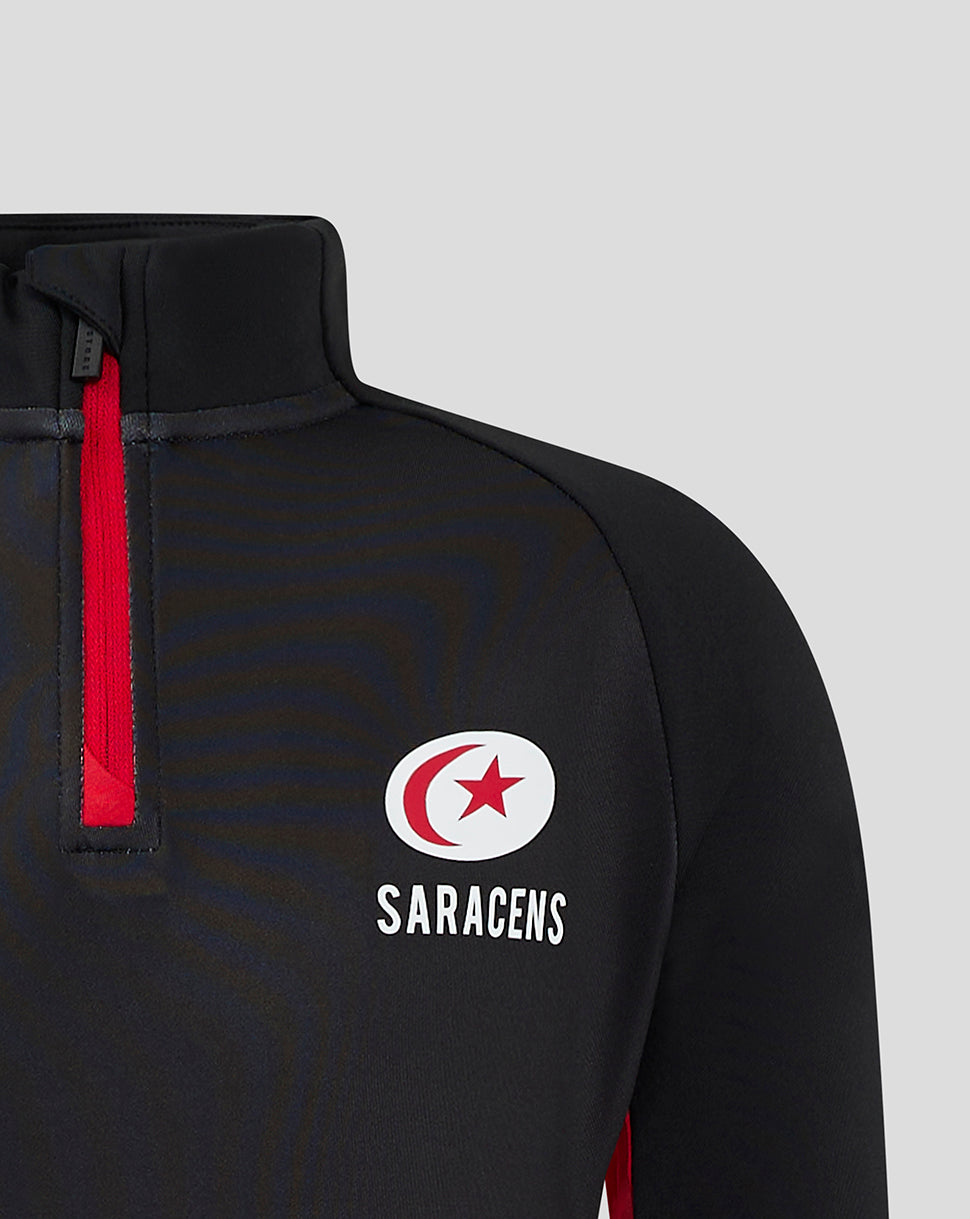 Close up of black quarter zip top with red zipper and Saracens crest on chest