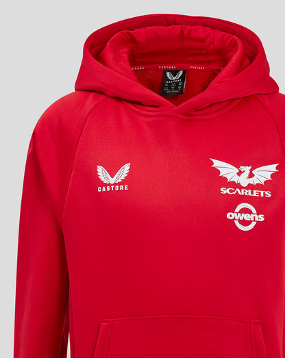 Red Scarlets hoody front chest close up showing Castore logo on left and Scarlets emblem on right.