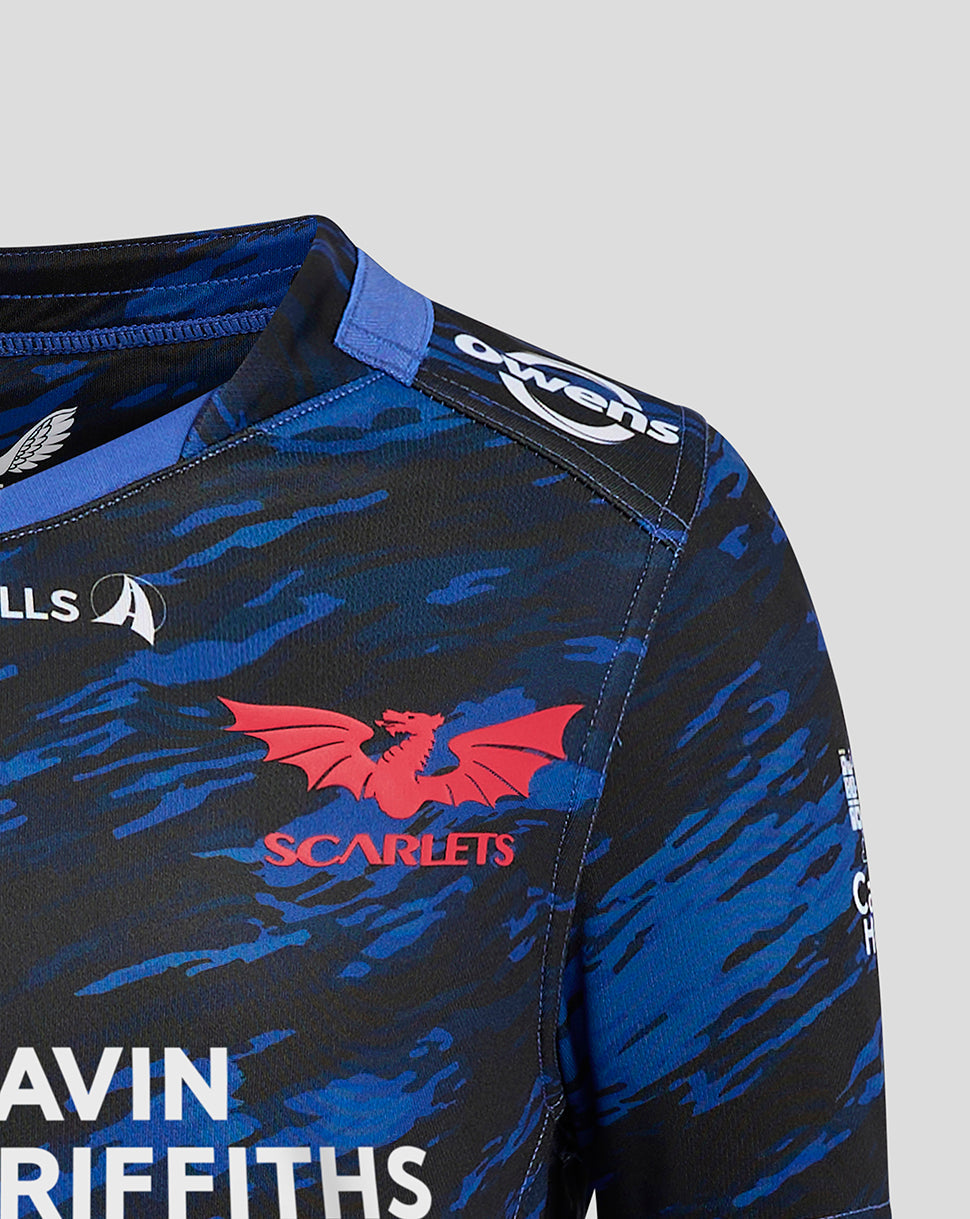 Close-up of Scarlets Junior Away shirt shoulder with blue camo print and red Scarlets crest