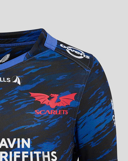 Close-up of Scarlets Junior Away shirt shoulder with blue camo print and red Scarlets crest