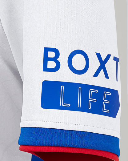 Rangers Junior Away Shirt sleeve close up showing BOX LIFE print in blue on white fabric with blue and red cuff trim