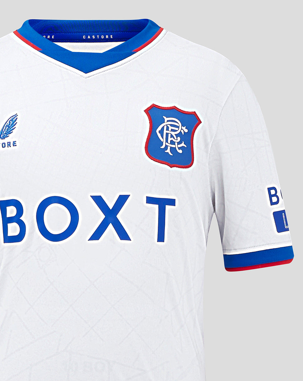 Close-up of upper chest on Rangers Junior Away Shirt showing crest on the right and Castore branding along the blue collar.
