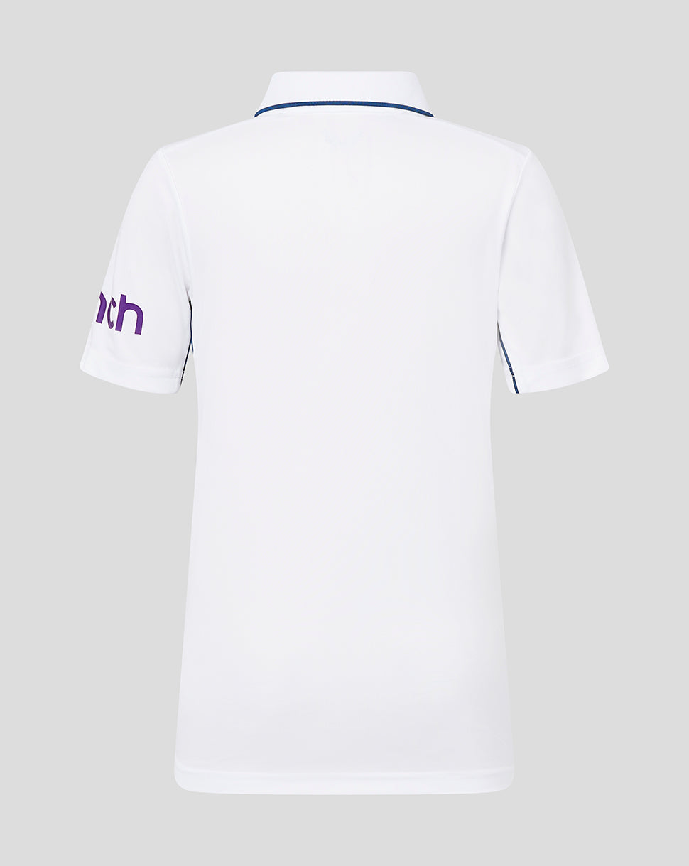 Back view of white infant England cricket short sleeve shirt with blue piping at the collar and purple cinch text on the left sleeve