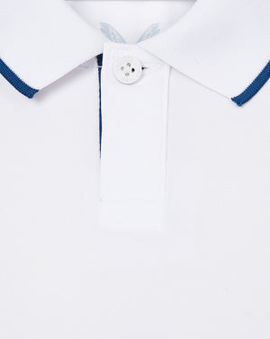 Close up of white infant England cricket shirt collar with blue tipped edges and button placket.