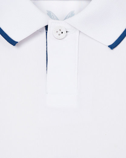 Close up of white infant England cricket shirt collar with blue tipped edges and button placket.