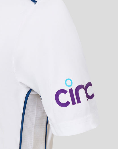 Infant England Test shirt close up showing chest crest Castore branding and blue shoulder piping.