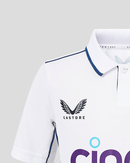 Close up of infant England Test shirt showing Castore logo on chest and sleeve detail with piping.