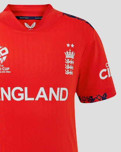 Red junior England World Cup T20 shirt front view with England crest on left chest and navy patterned shoulder trim.
