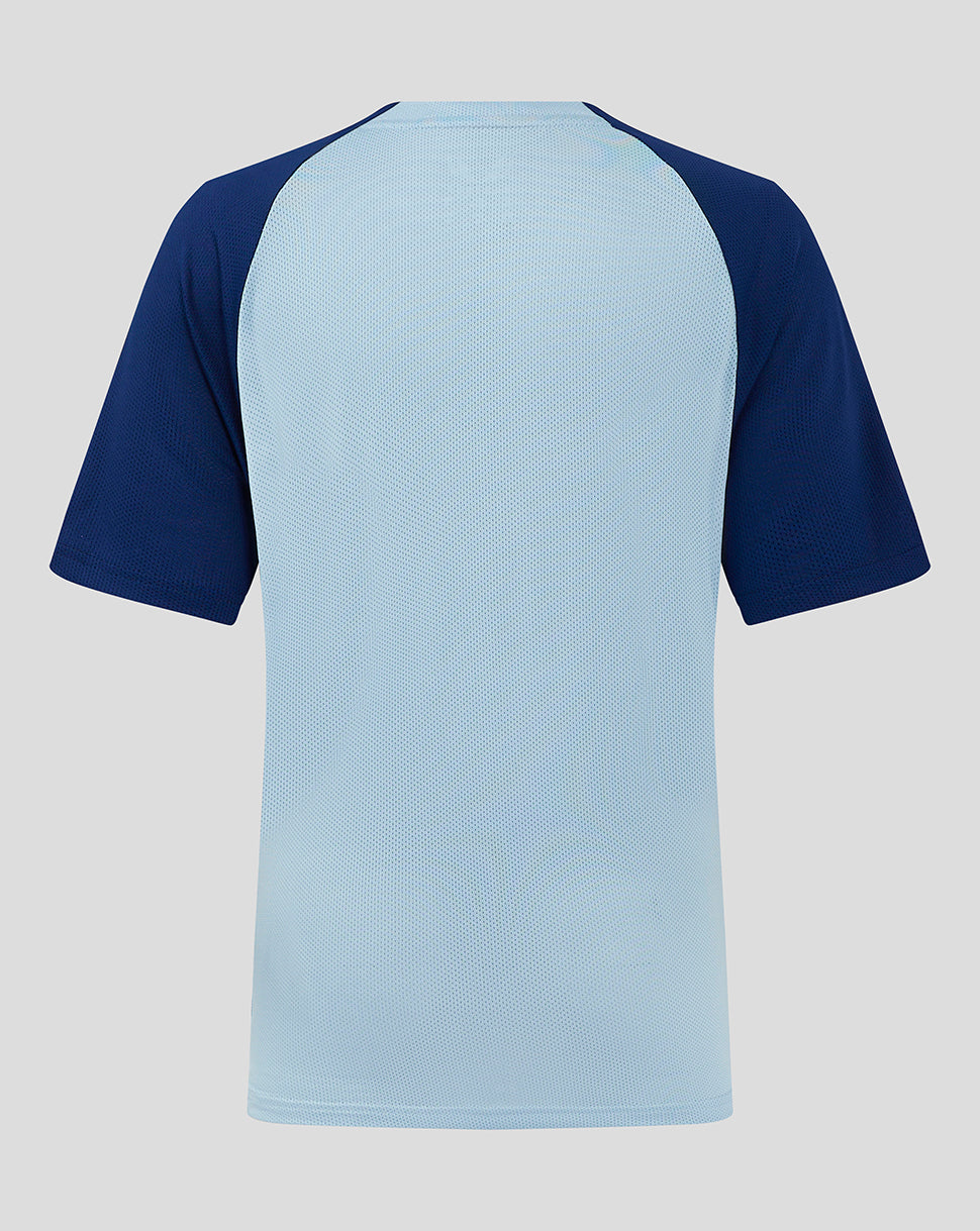 Back view of Rangers Junior training shirt showing light blue torso with dark navy raglan sleeves