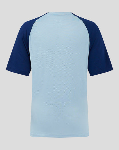 Back view of Rangers Junior training shirt showing light blue torso with dark navy raglan sleeves