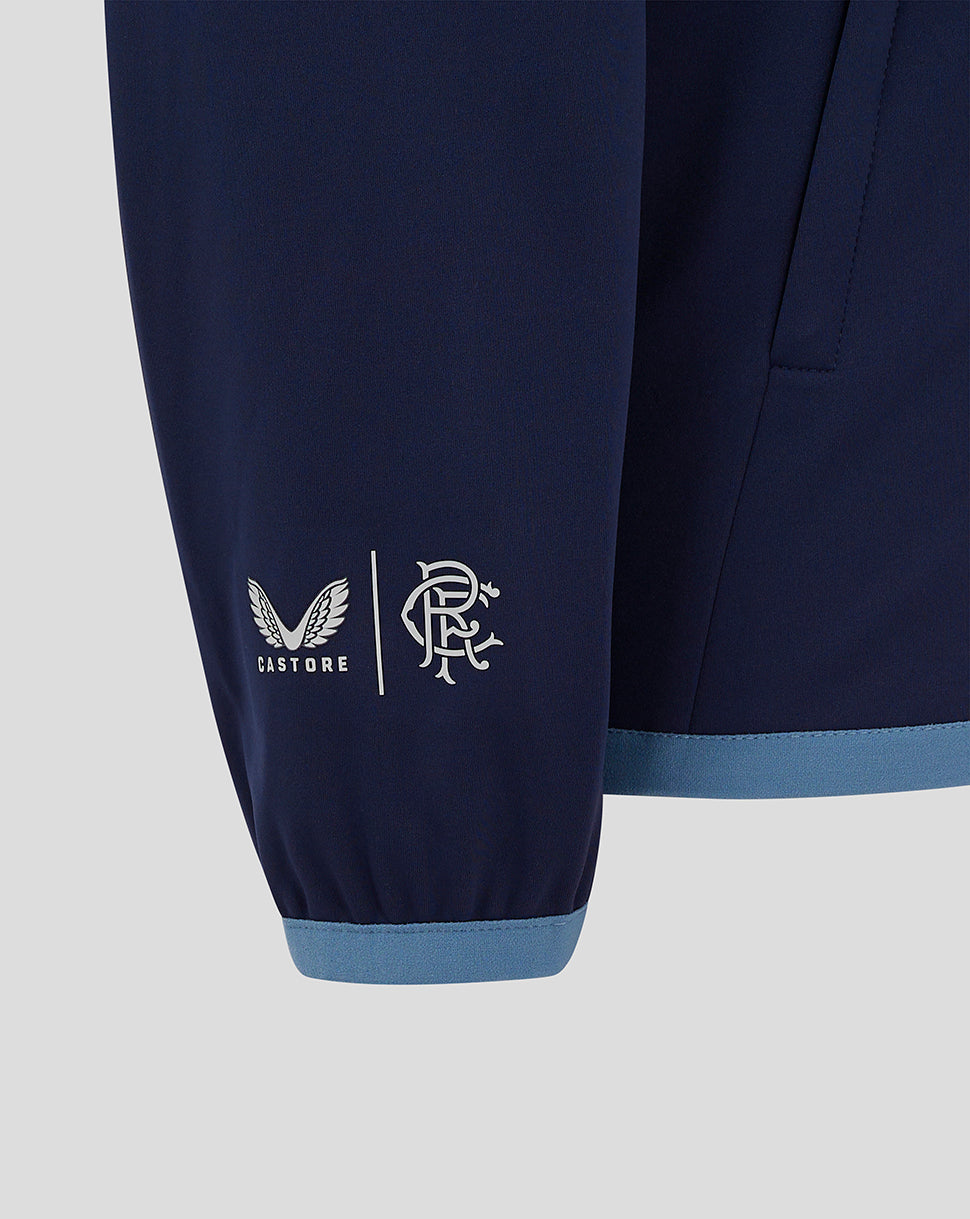 Navy Rangers FC travel jacket sleeve with Castore logo and club crest at the cuff and a light blue hem