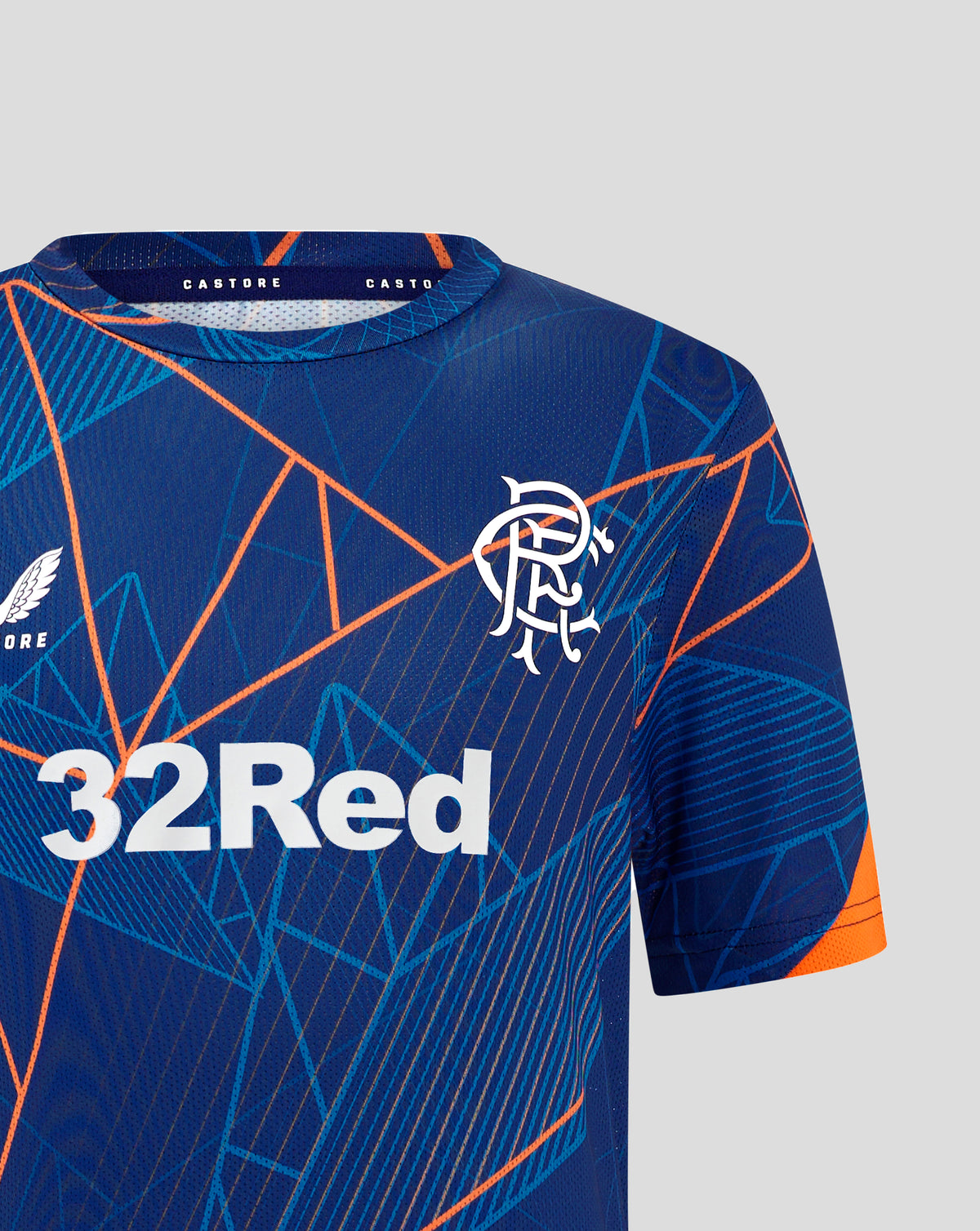Close up of Rangers League Matchday T Shirt in blue with orange geometric lines and left chest crest