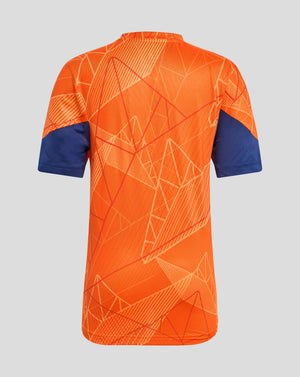 Back view of bright orange junior league matchday T shirt with geometric line pattern across the fabric