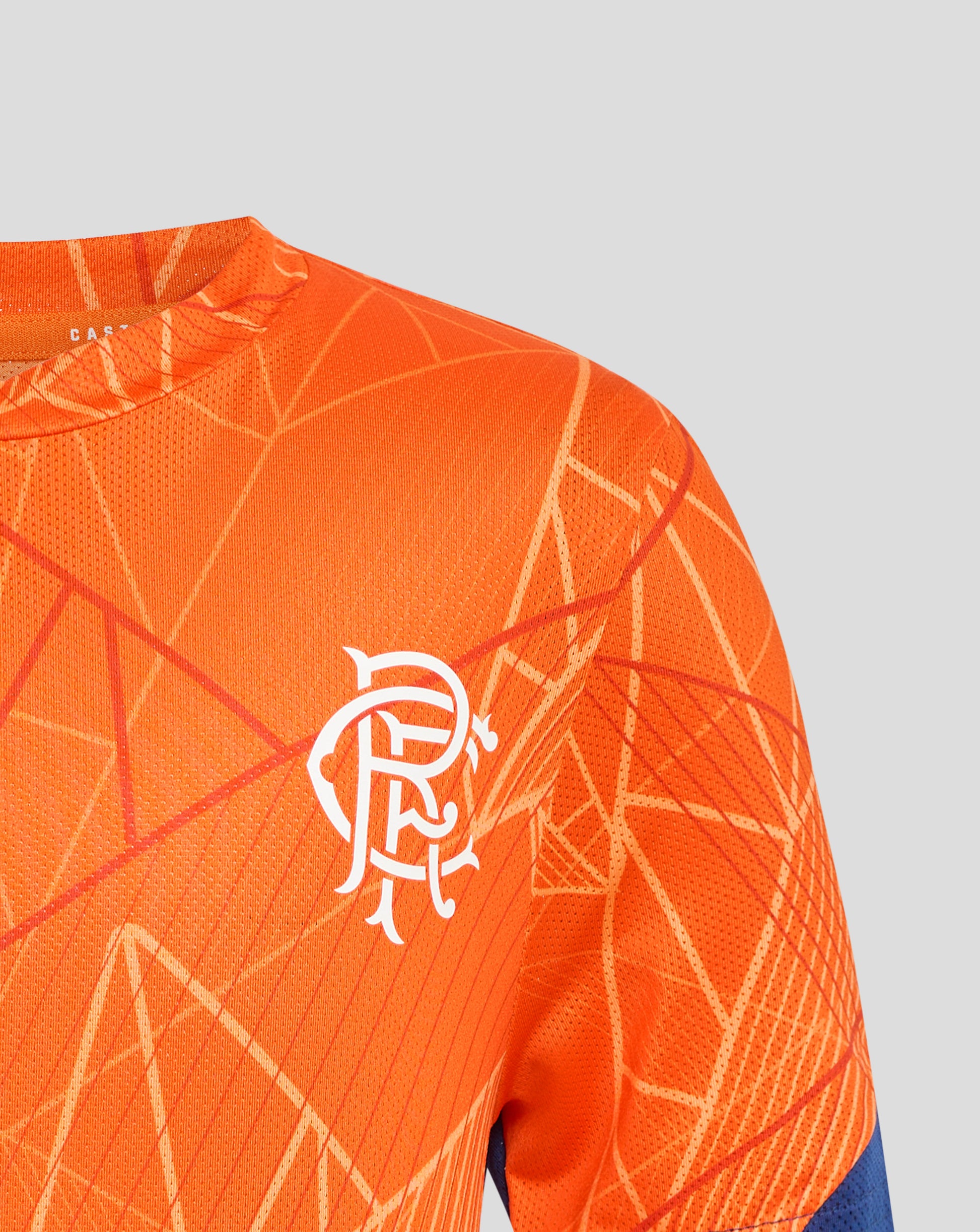 Front view of orange Rangers 24/25 Junior League Matchday T Shirt showing white crest on chest and geometric pattern.