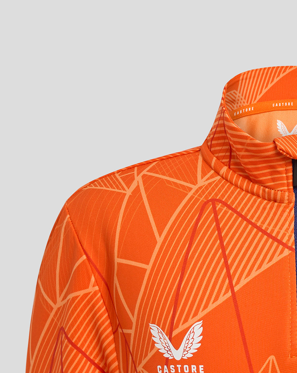 Close up of the orange patterned collar and shoulder of the Rangers midlayer showing Castore branding