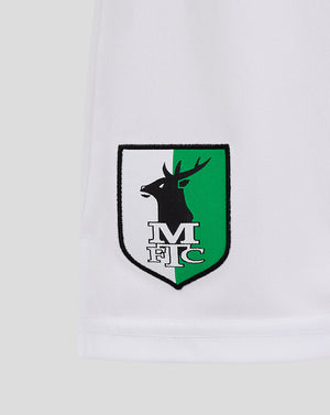White Mansfield Junior Away Shorts close up of the right thigh shield crest in black white and green