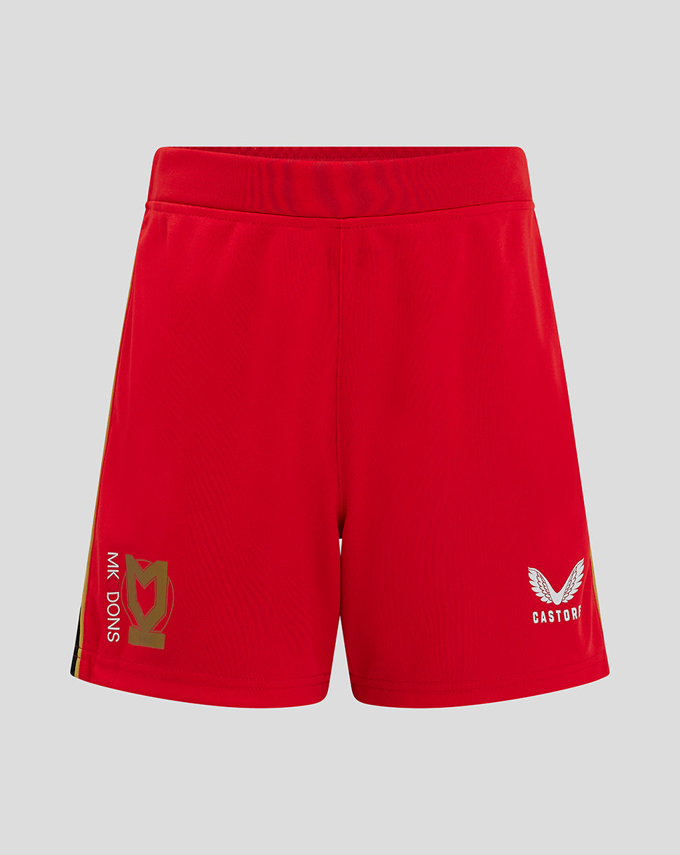 Front view of red Mk Dons Junior 24/25 Away Short with gold crest on left leg and Castore logo on right leg