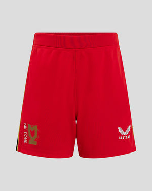 Front view of red Mk Dons Junior 24/25 Away Short with gold crest on left leg and Castore logo on right leg