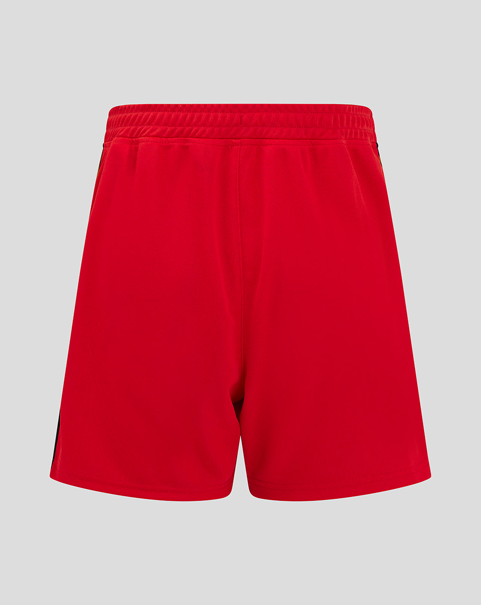 Red Mk Dons junior away shorts with a black and gold side stripe