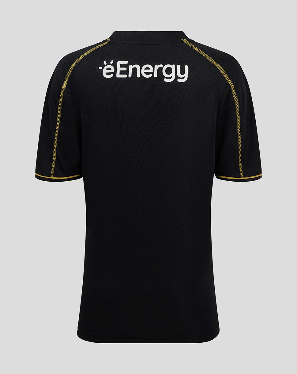 Back view of black MK DONS junior 24/25 third shirt with white éEnergy logo and gold shoulder piping.