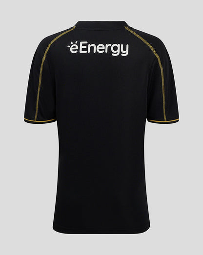 Back view of black MK DONS junior 24/25 third shirt with white éEnergy logo and gold shoulder piping.