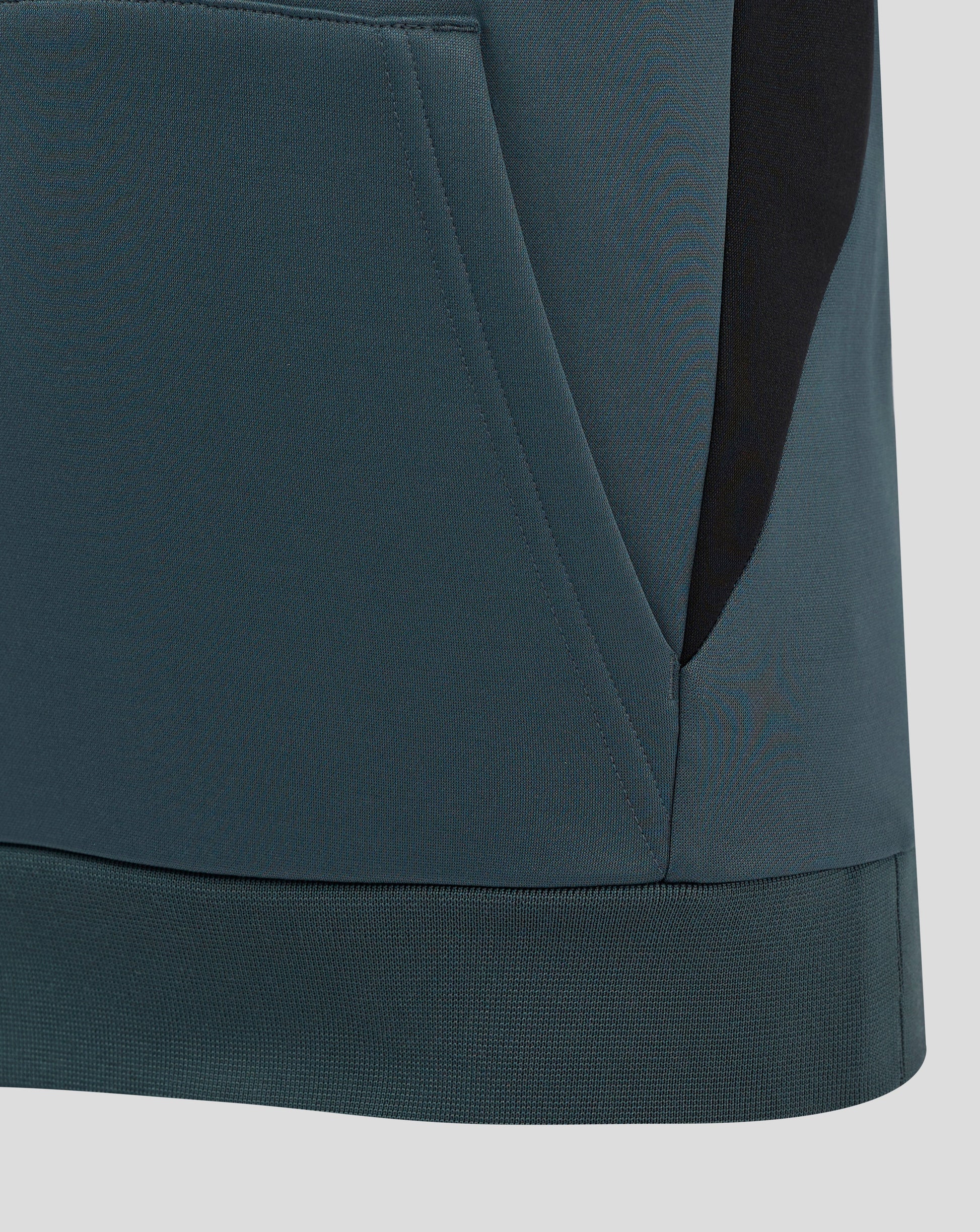 Close-up of teal Bath Rugby Junior training hoodie fabric detailing a front pocket and curved hem