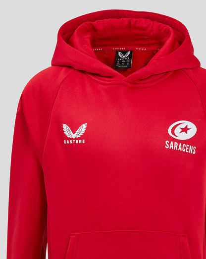 Upper torso view of red training hoodie with hood up and prominent Castore and Saracens logos on chest.
