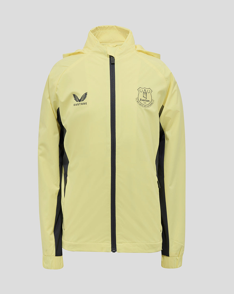 Everton 24/25 Junior Training Rain Jacket front view in pale yellow with black side panels and crest on the chest