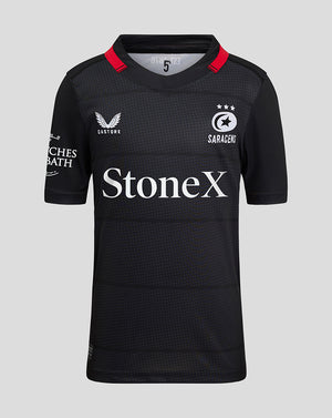 Saracens Junior 24/25 Home Shirt in black with subtle pattern left chest crest and StoneX across front