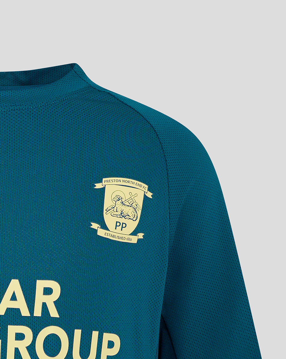 Close-up of left chest showing the club crest on teal Preston Junior training T shirt